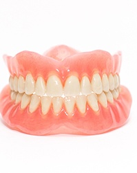 A smiling woman enjoying her dentures